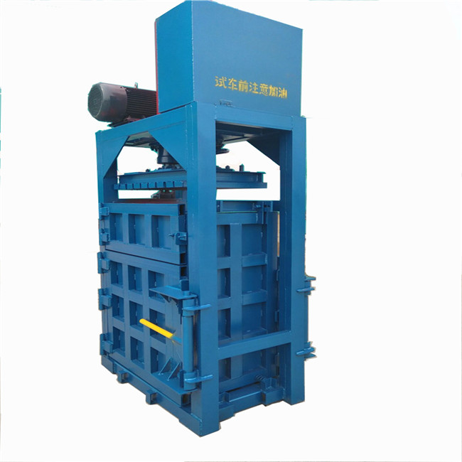 Vertical hydraulic baler for wool/machine baler