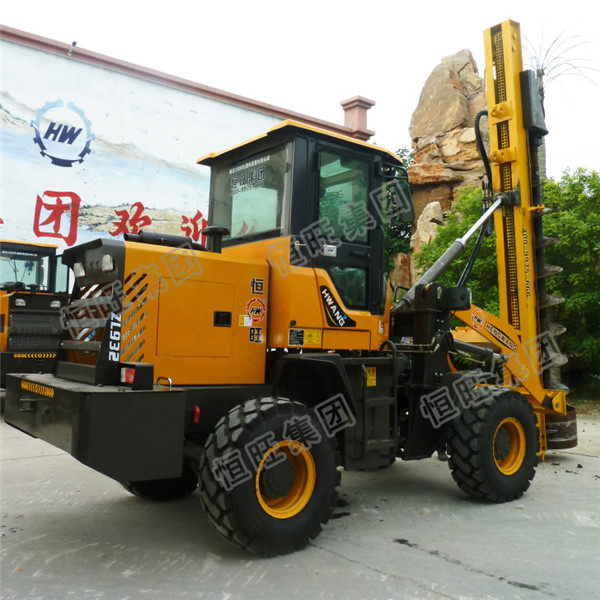 Loader modified spiral pile driver machine