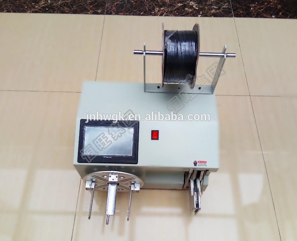Small toroidal inductor coil winding machine with coil
