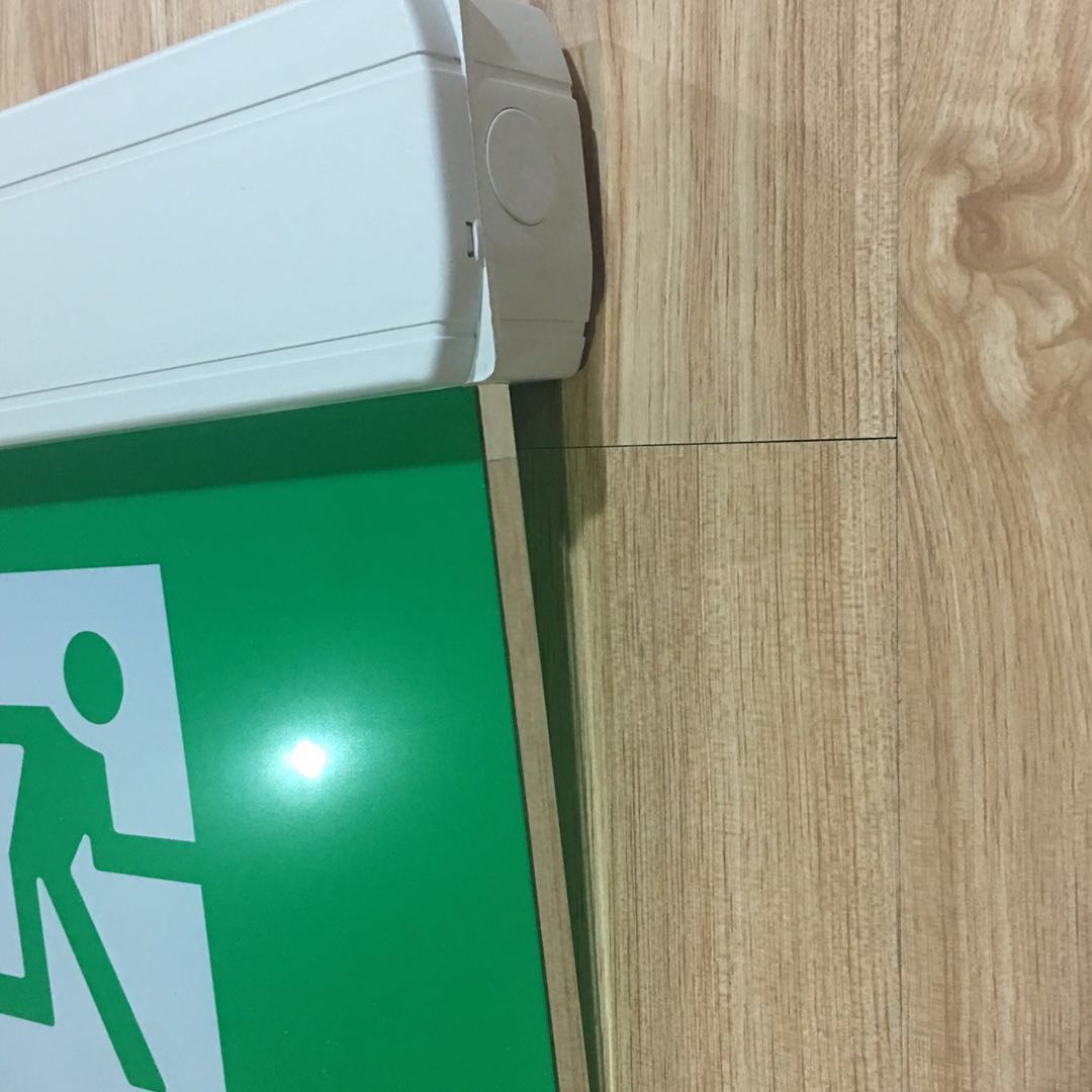 Green running man emergency exit sign backup charging light