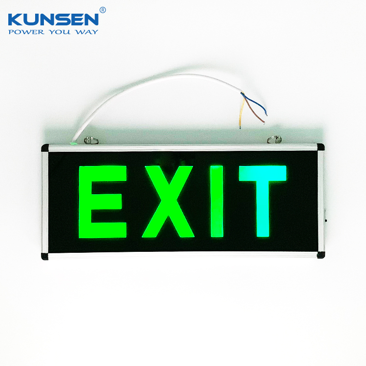 Traditional green emergency exit sign for public place