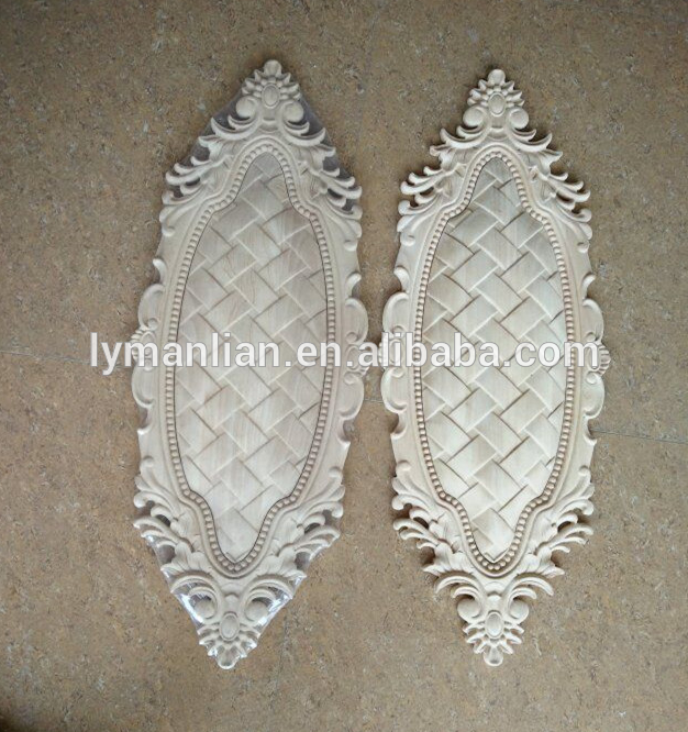 Ornate oval scroll wood plaque