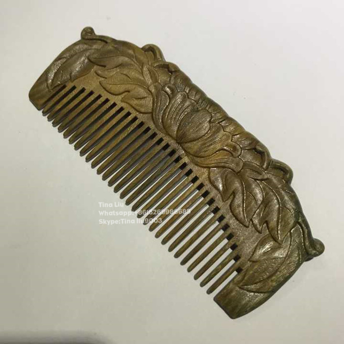 carved wooden hair comb